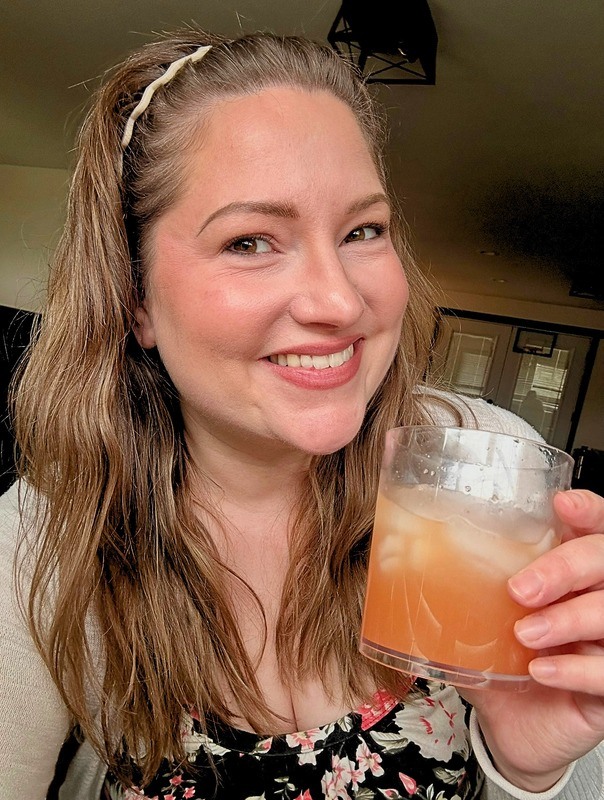 Catrina smiling in a lifestyle portrait